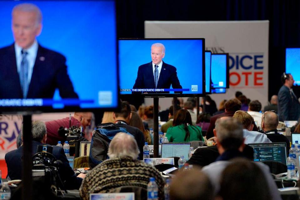 Then-Democratic presidential hopeful former Vice President Joe Biden is seen on screens in the spin room during the eighth Democratic primary debate of the 2020 presidential campaign season co-hosted by ABC News, WMUR-TV and Apple News at St. Anselm College in Manchester, New Hampshire on February 07, 2020.