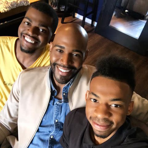 <p>Karamo Brown Instagram</p> Karamo Brown with his sons Jason "Rachel" Brown and Christian Brown