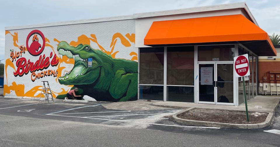 A mural by local artists Carrie and Jesus Martinez, also known as Visionary FAM, on the side of the new Hot Birdie's Chicken restaurant at 3606 SW Archer Road in Gainesville.