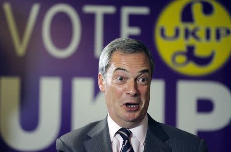 Nigel Farage, leader of the United Kingdom Independence Party (UKIP), speaks at his local party headquarters in Rochester, southeast England, November 21, 2014. REUTERS/Suzanne Plunkett