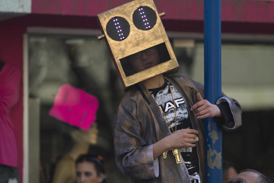 An Israeli boy in costume watches a Purim parade in Holon, Israel, Thursday, March 8, 2012. (AP Photo/Dan Balilty)