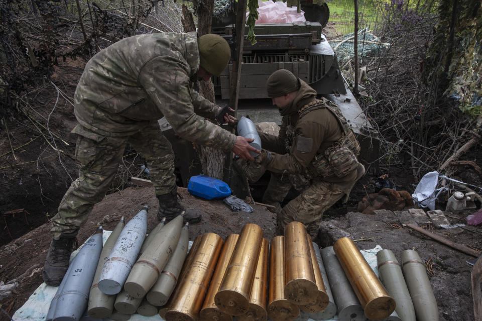 Ukrainian soldiers prepare self-propelled howitzer shells in Chasiv Yar, the site of heavy battles with the Russian forces in the Donetsk region, Ukraine, Thursday, May 11, 2023. (Iryna Rybakova via AP)