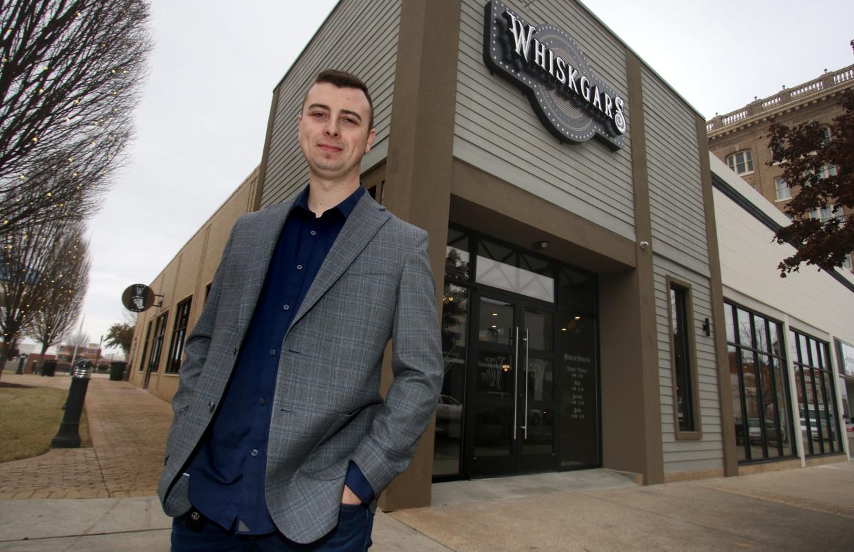 Owner Jacob Hibberts stands outside of WhiskGars Cigar & Co. on West Main Ave. in Gastonia  Thursday morning, Jan. 20, 2022.