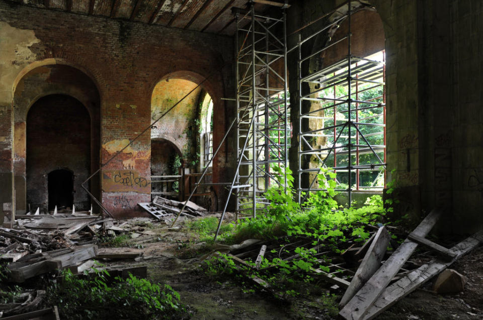 greenery and graffiti have overtaken the ruins