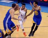 May 22, 2016; Oklahoma City, OK, USA; Oklahoma City Thunder guard Russell Westbrook (0) drives to the basket as Golden State Warriors guard Shaun Livingston (34) defends during the second quarter in game three of the Western conference finals of the NBA Playoffs at Chesapeake Energy Arena. Mandatory Credit: Mark D. Smith-USA TODAY Sports