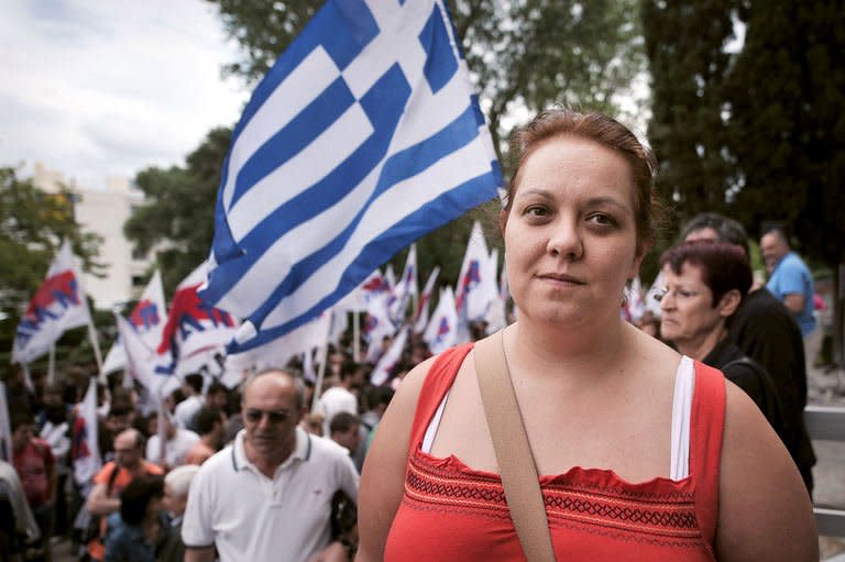 Olga Pagaiossif takes part in a demonstration at the entrance of the Greek public broadcaster ERT in Athens on June 13, 2013