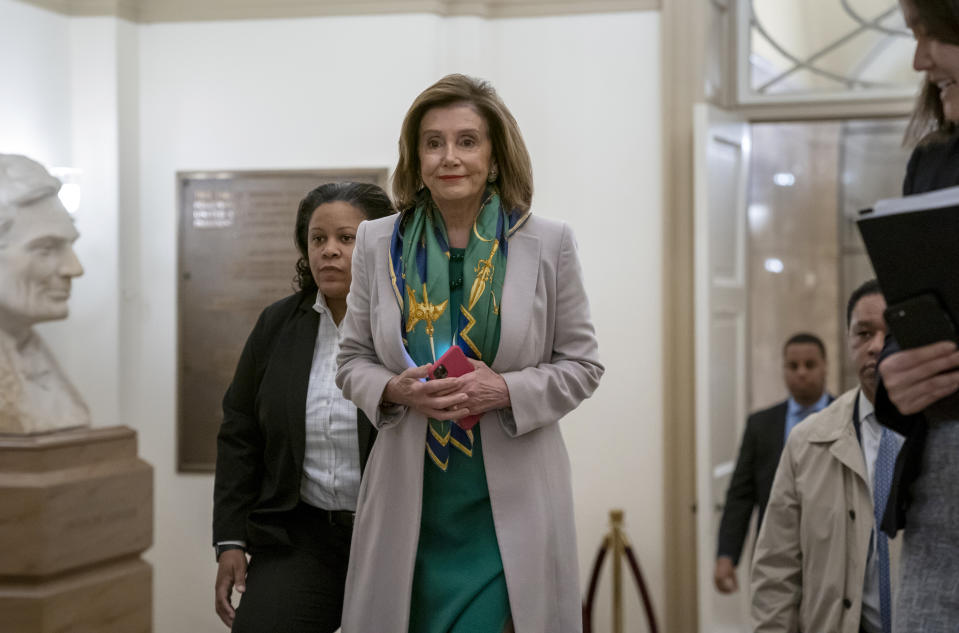 Speaker of the House Nancy Pelosi, D-Calif., arrives to meet with the Democratic Caucus at the Capitol in Washington, Tuesday, Jan. 14, 2020. Pelosi, who has not yet relayed the articles of impeachment to the Senate for the trial of President Donald Trump, has said she will discuss her next steps in that delayed process during her meeting today with fellow Democrats. Trump was impeached by the Democratic-led House last month on charges of abuse of power over pushing Ukraine to investigate Democratic rival Joe Biden and obstruction of Congress in the probe. (AP Photo/J. Scott Applewhite)