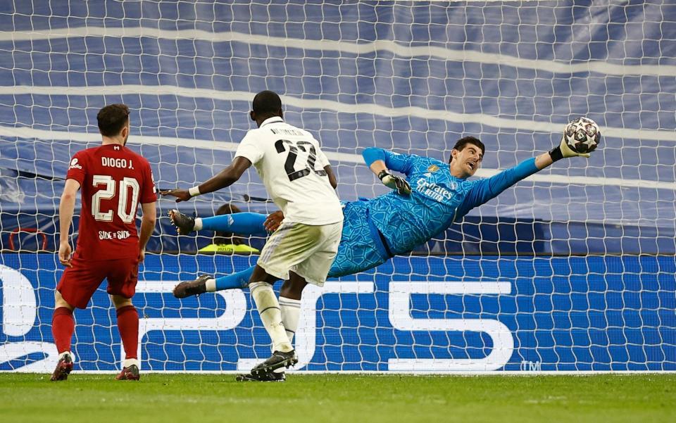 Real Madrid's Thibaut Courtois saves a shot from Liverpool's Darwin Nunez a - REUTERS/Juan Medin