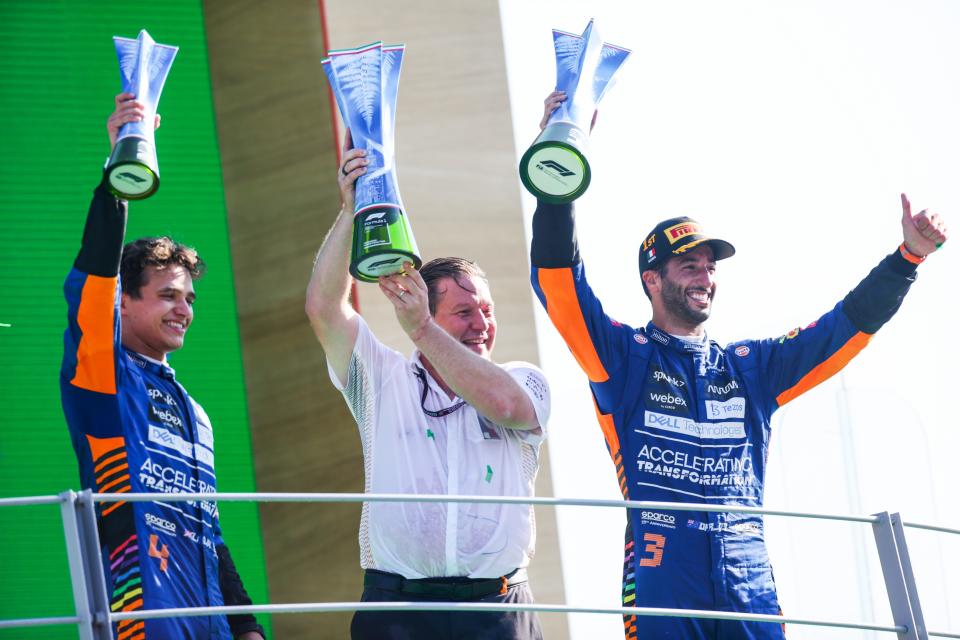 MONZA, ITALY - SEPTEMBER 12: Lando Norris (LEFT), Zac Brown (MIDDLE), and Daniel Ricciardo (RIGHT) of McLaren celebrate on the podium of the F1 Grand Prix of Italy at Autodromo di Monza. It was the team's first win since 2012. (Photo by Peter Fox/Getty Images)