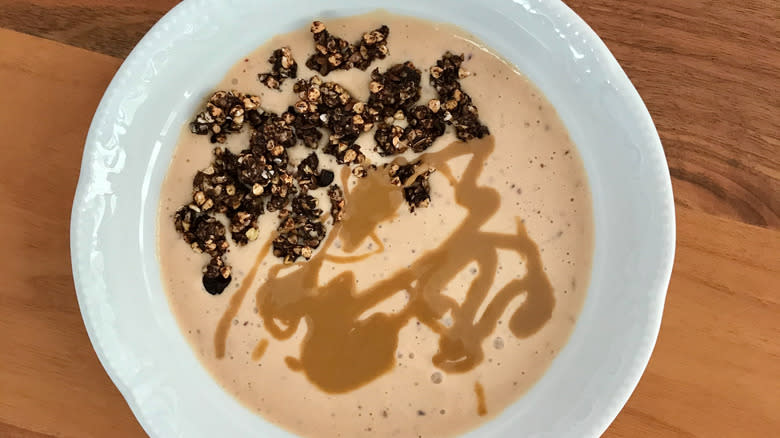 tahini drizzled onto breakfast bowl