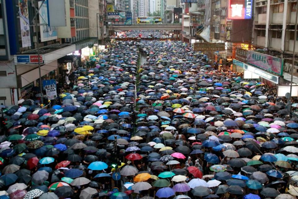 Hundreds of thousands of protesters dressed in black from all ages rallying in Victoria Park in Hong Kong on Sunday.