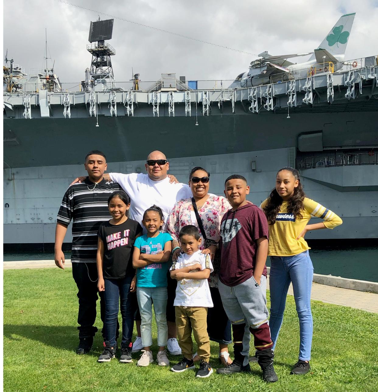 A 2019 photo shows Iliah Miguel, second from the right, with his family. Iliah Miguel, 14, was part of a group of people who rushed to help the victim of a shooting at the Oklahoma State Fair.