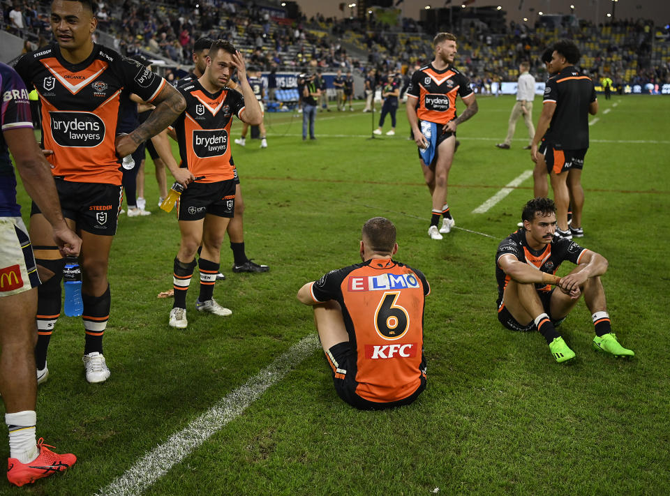 The Tigers (pictured) look dejected after losing the round 19 NRL match against North Queensland Cowboys.