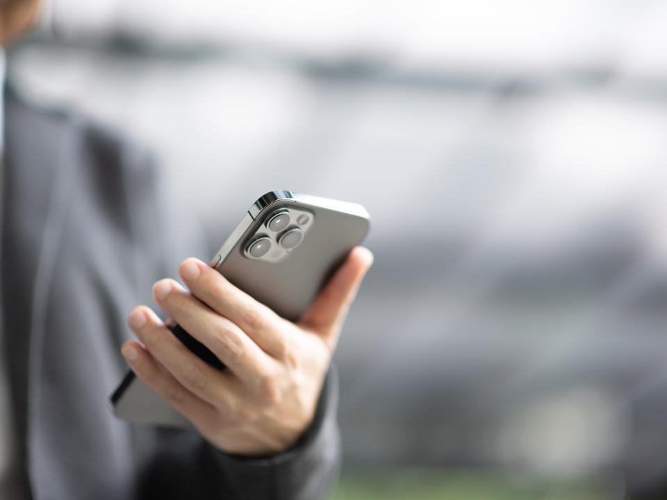 Bangkok, Thailand - Jan 13, 2021: Close up hand holding black smartphone iPhone 12 Pro Max (Getty Images)