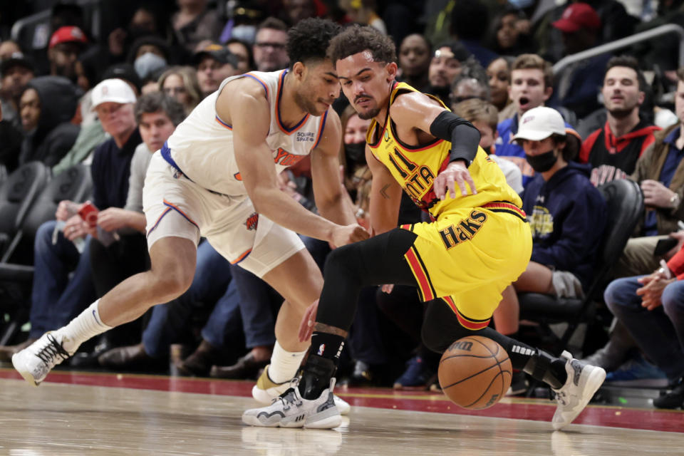 Atlanta Hawks guard Trae Young (11) looses control of the ball as New York Knicks guard Quentin Grimes (6) defends during the second half of an NBA basketball game Saturday, Jan. 15, 2022, in Atlanta. (AP Photo/Butch Dill)