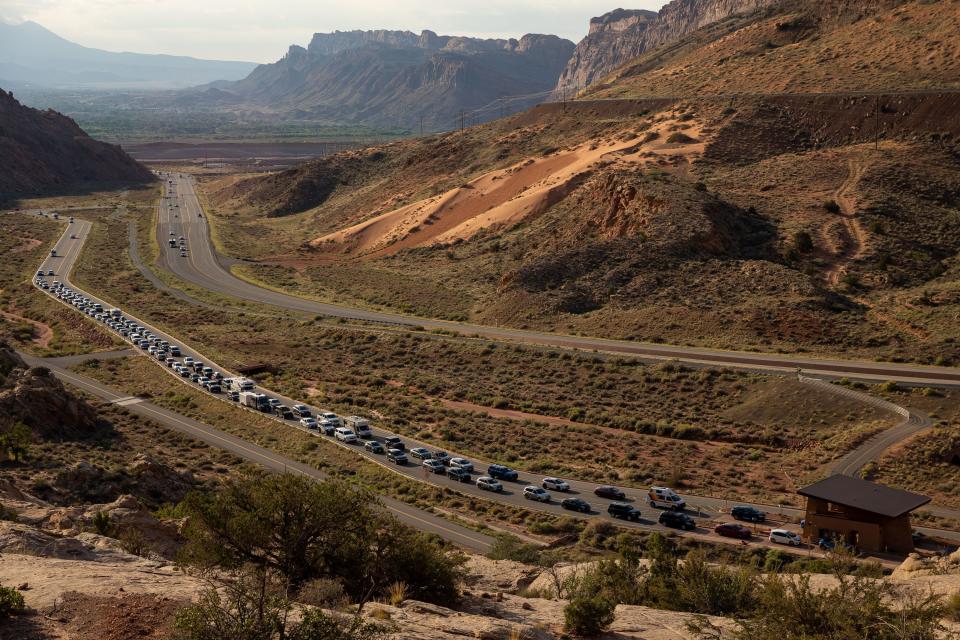The entrance road to Arches National Park outside Moab begins to back up with visitors on Sunday, Sept. 19, 2021. | Spenser Heaps, Deseret News