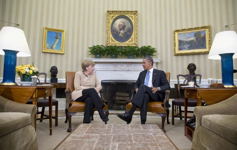 President Barack Obama meets with German Chancellor Angela Merkel in the Oval Office of the White House in Washington, Friday, May 2, 2014. Obama and Merkel are mounting a display of trans-Atlantic unity against an assertive Russia, even as sanctions imposed by Western allies seem to be doing little to change Russian President Vladimir Putin's reasoning on Ukraine. (AP Photo/Carolyn Kaster)