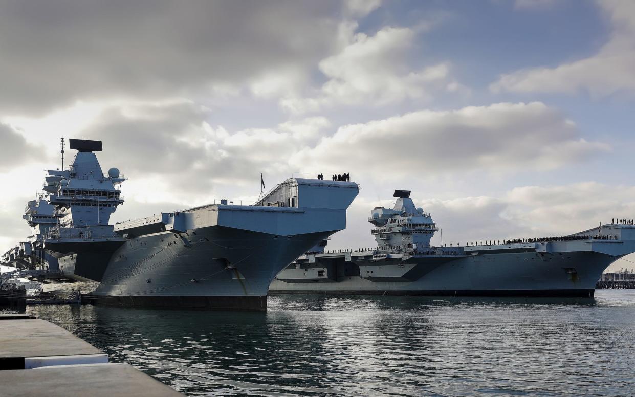 HMS Queen Elizabeth and HMS Prince of Wales, Britain's two new aircraft carriers, together in their home port of Portsmouth.  - LPhot Ben Corbett/MoD/Crown Copyright/PA