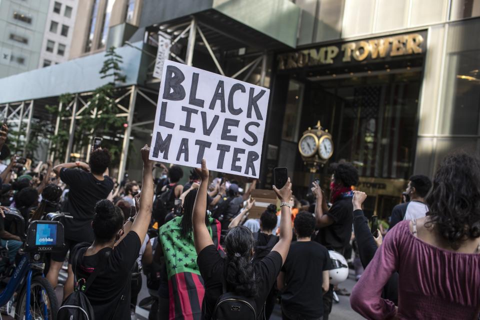 Protesters march in front of Trump Tower during a solidarity rally for George Floyd, Saturday, May 30, 2020, in New York. Demonstrators took to the streets of New York City to protest the death of Floyd, a black man who was killed in police custody in Minneapolis on May 25. (AP Photo/Wong Maye-E)