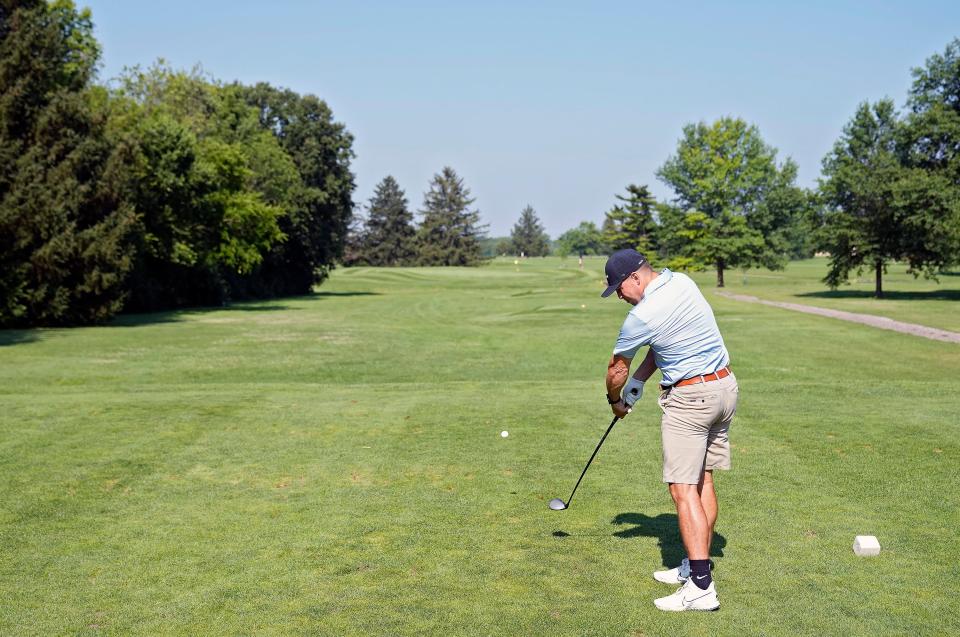 Jul 21, 2022; Galloway, OH, USAT; Scott Eckert tees off on the 11th hole at Thorn Apple Country Club in Galloway, Ohio on July 21, 2022. The 245-yard par-3 hole is one of the most difficult golf holes in central Ohio. 