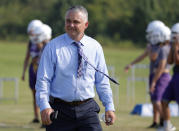 In this Aug. 5, 2019 photo, superintendent Jason McCullough watches the teams' first practice with newly hired head coach Art Briles at Mount Vernon High School in Mount Vernon, Texas. (AP Photo/Tony Gutierrez)