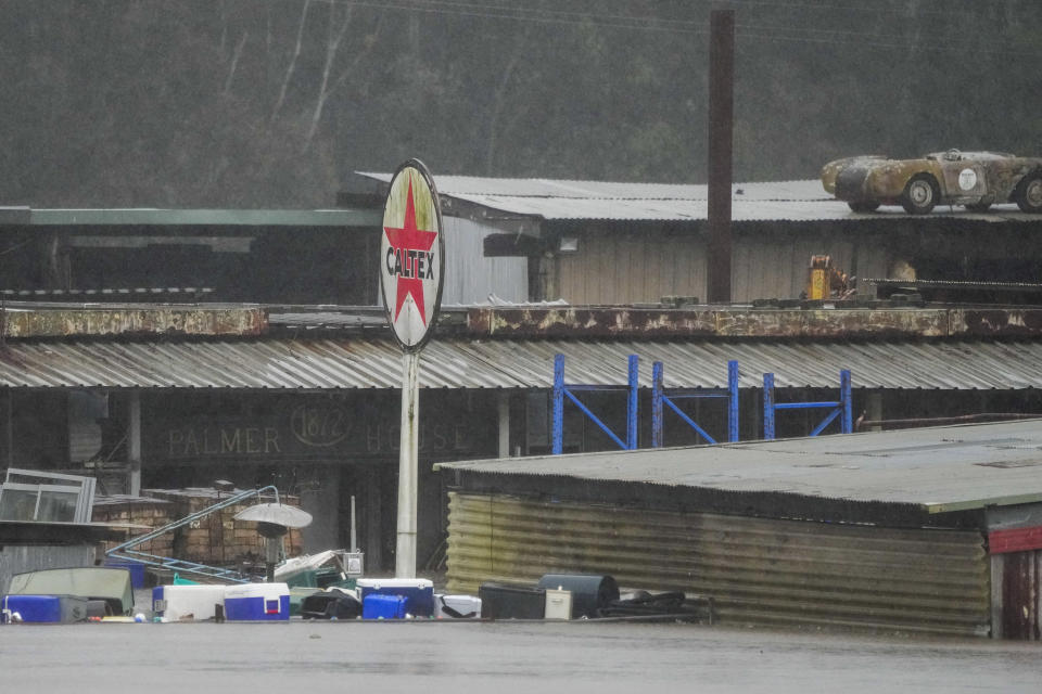 Flood waters surround an industrial property in Londonderry on the outskirts of Sydney, Australia, Monday, July 4, 2022. More than 30,000 residents of Sydney and its surrounds have been told to evacuate or prepare to abandon their homes on Monday as Australia's largest city braces for what could be its worst flooding in 18 months. (AP Photo/Mark Baker)