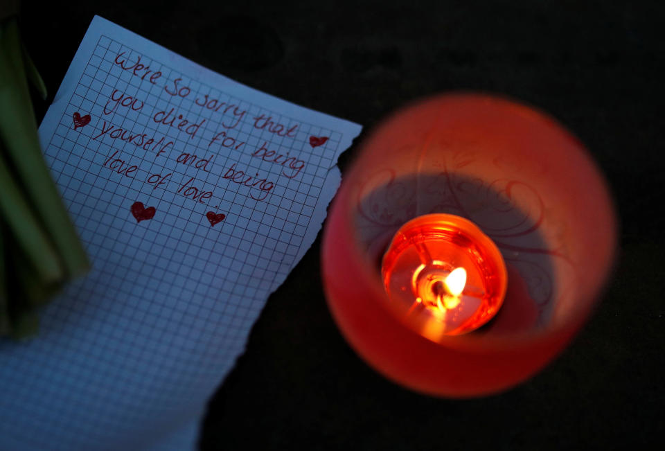 A handwritten note is left following a candlelit vigil in memory of the victims of the gay nightclub mass shooting in Orlando, outside St Georges Hall in Liverpool, northern England, June 13, 2016.&nbsp;