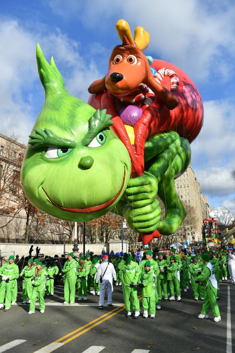 It was impossible to miss the Grinch and Max's bright and colorful float, which was held down by 90 handlers dressed in green.