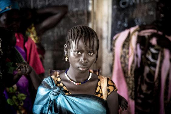 This young woman in Pibor regularly faces assault on her way to collect water, firewood and food (Bel Trew)