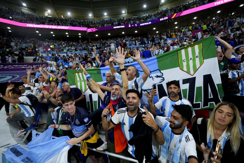 Argentina's fans celebrate winning the World Cup round of 16 soccer match between Argentina and Australia at the Ahmad Bin Ali Stadium in Doha, Qatar, Saturday, Dec. 3, 2022. (AP Photo/Petr David Josek)