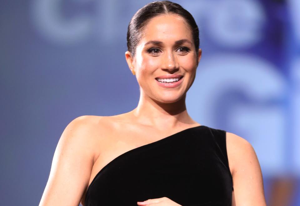 Meghan Markle is currently catching heat for, wait for it, cradling her baby bump. She's getting mommy-shamed but hasn't even given birth yet,