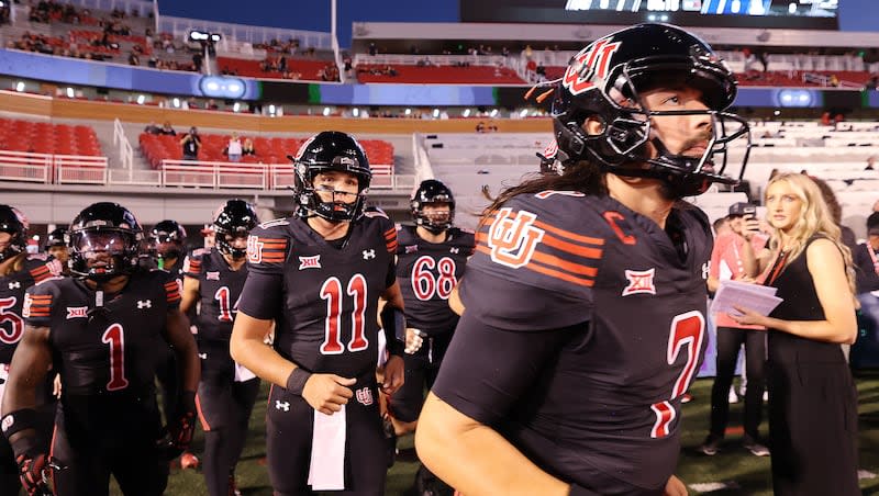 Utah Utes quarterback Cameron Rising (7) and Utah Utes quarterback Isaac Wilson (11) run onto the field for warmups against the Arizona Wildcats in Salt Lake City on Saturday, September 28, 2024.