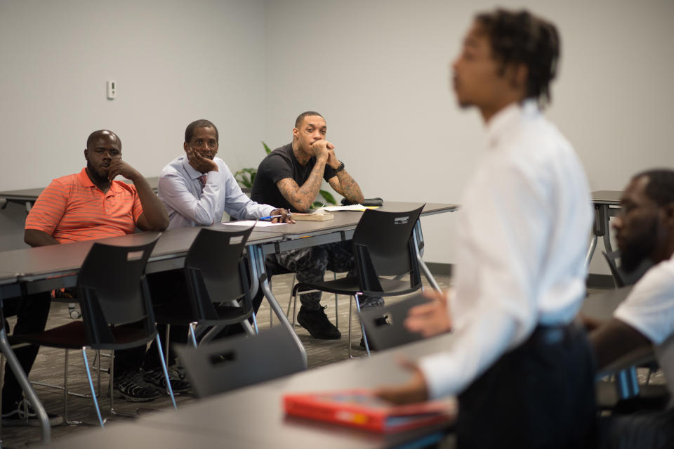 A participant speaks during a 'Save Our Sons' course.