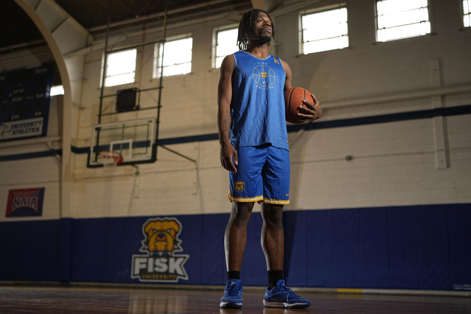 Fisk University basketball player Jeremiah Armstead poses for a portrait Wednesday, March 6, 2024, in Nashville, Tenn. The formerly homeless Armstead will receive the U.S. Basketball Writers Association 2024 Perry Wallace Most Courageous award at the NCAA Final Four basketball tournament. (AP Photo/George Walker IV)