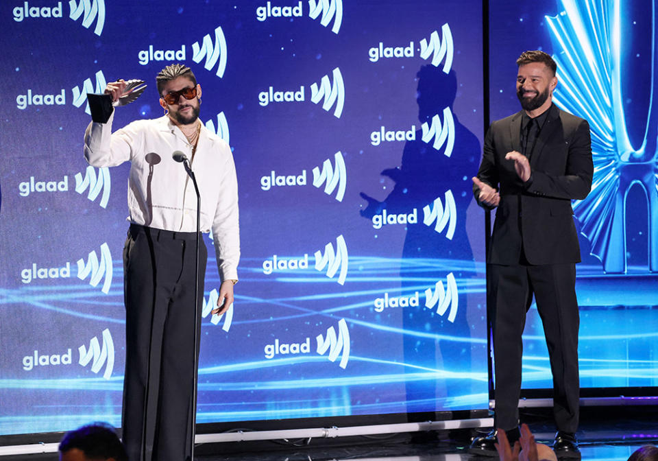 (L-R) Bad Bunny and Ricky Martin speak onstage during the GLAAD Media Awards at The Beverly Hilton on March 30, 2023 in Beverly Hills, California.