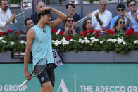 Alexander Zverev, of Germany, walks on the court during the final match with Carlos Alcaraz, of Spain, at the Mutua Madrid Open tennis tournament in Madrid, Spain, Sunday, May 8, 2022. (AP Photo/Paul White)