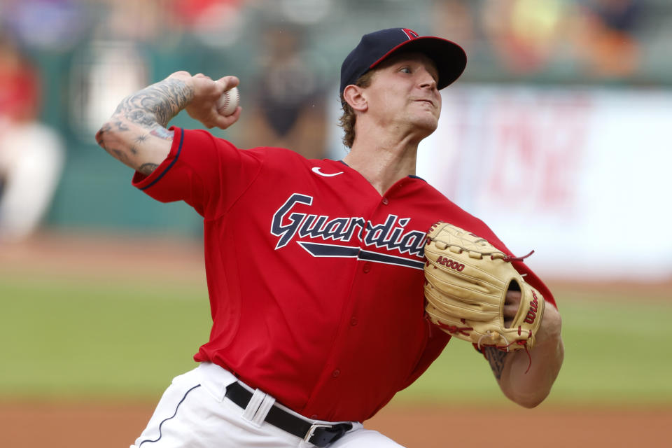 Cleveland Guardians starting pitcher Zach Plesac delivers against the Houston Astros during the first inning of a baseball game Thursday, Aug. 4, 2022, in Cleveland. (AP Photo/Ron Schwane)