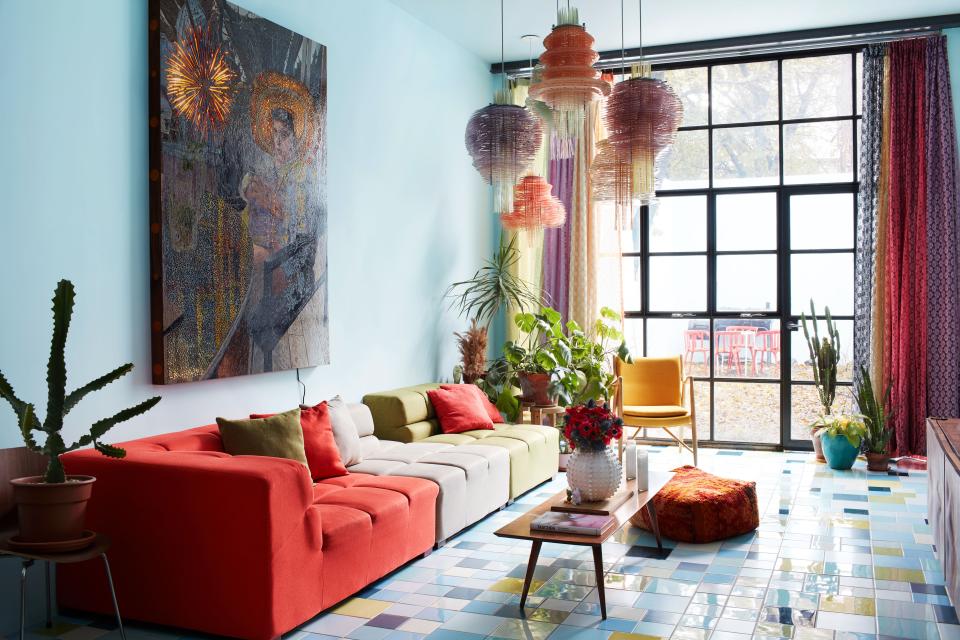 For the main living space of his home in Bushwick, Brooklyn, artist Jorge Pardo conceived signature lamps and splashes of tilework; the painting is also by Pardo.