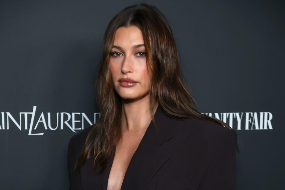 <p>Alberto Rodriguez/WWD via Getty</p> Hailey Bieber at the Vanity Fair x Saint Laurent x NBCUniversal "Oppenheimer" Film Toast 