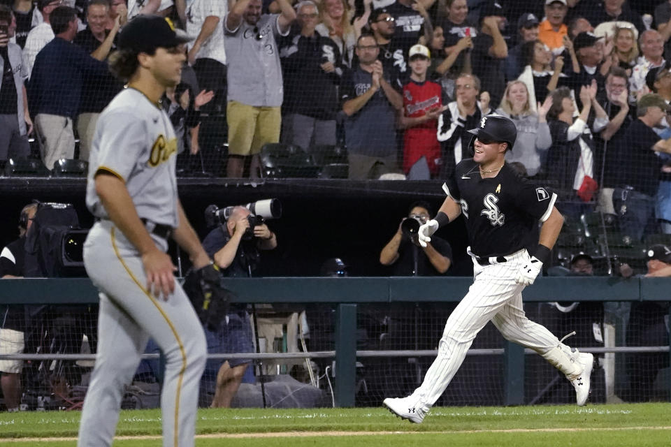 Chicago White Sox's Gavin Sheets, right, heads home after his three-run home run off Pittsburgh Pirates starting pitcher Max Kranick, left, during the fourth inning of a baseball game Wednesday, Sept. 1, 2021, in Chicago. (AP Photo/Charles Rex Arbogast)