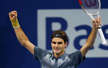 Switzerland's Roger Federer reacts after winning his semi-final match against Vasek Pospisil of Canada at the Swiss Indoors ATP tennis tournament in Basel October 26, 2013. REUTERS/Arnd Wiegmann