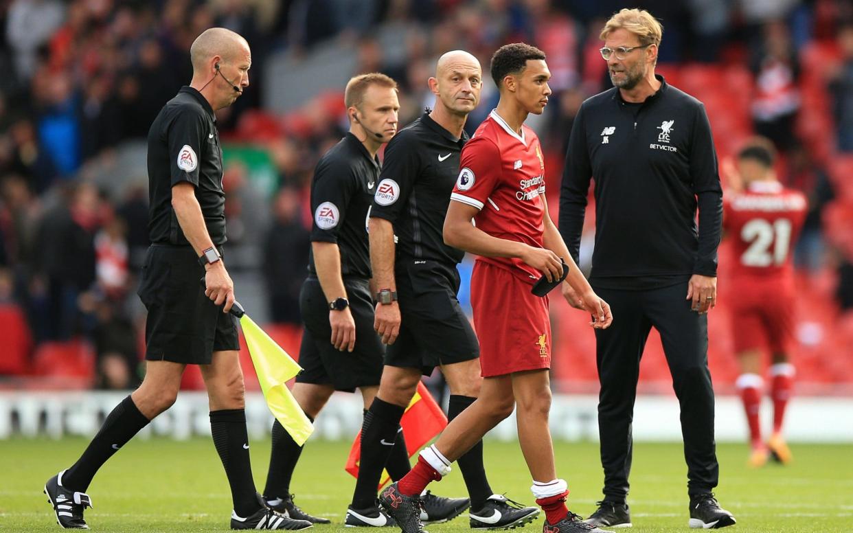 Jurgen Klopp speaks to the ref after Liverpool's draw with Burnley - PA