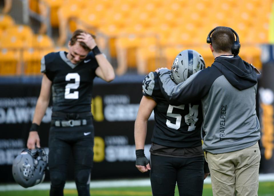 South Side's Casey Lewis is consoled after the Rams' loss to Fort Cherry at Acrisure Stadium in Pittsburgh.