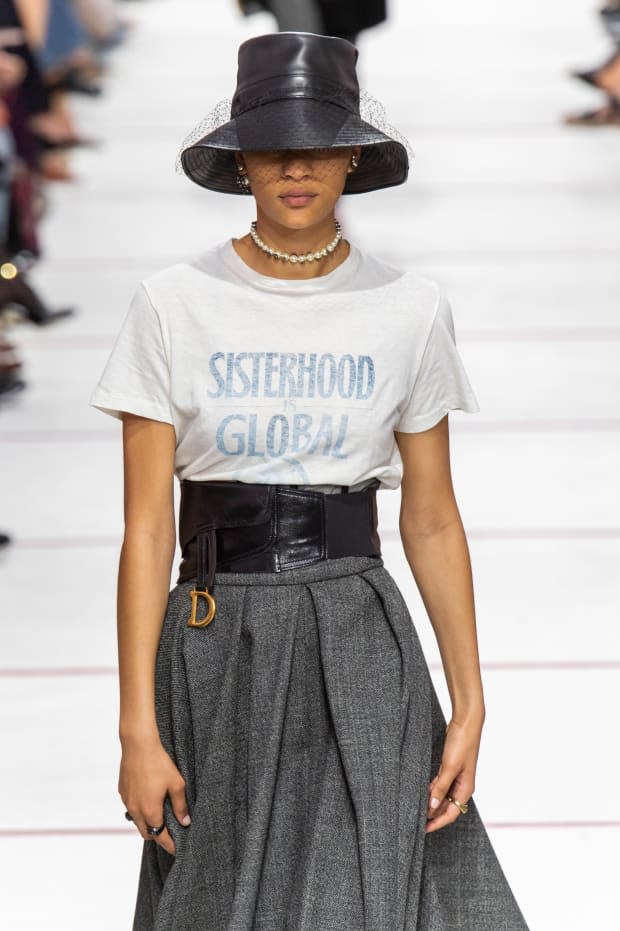 The opening look of Chiuri's Fall 2019 runway for Dior, referencing Robin Morgan's "Sisterhood Is Global". <p>Photo: Imaxtree</p>