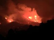 The Sand Fire rages along the ridgeline at night in the Capay Valley in California