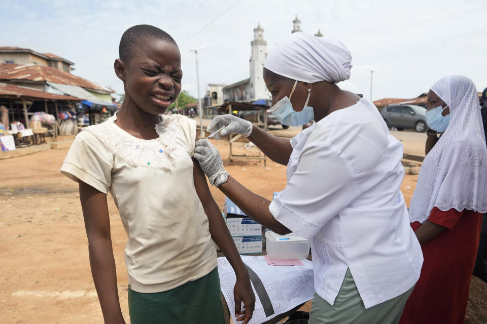 A health worker administers a cervical cancer vaccine HPV Gardasil to a girl on the street in Ibadan, Nigeria, on May 27, 2024. African countries have some of the world's highest rates of cervical cancer. Growing efforts to vaccinate more young girls for the human papillomavirus are challenged by the kind of vaccine hesitancy seen for some other diseases. Misinformation can include mistaken rumors that girls won't be able to have children in the future. Some religious communities must be told that the vaccine is "not ungodly." More than half of Africa's 54 nations – 28 – have introduced the vaccine in their immunization programs, but only five have reached the 90% coverage that the continent hopes to achieve by 2030. (AP Photo/Sunday Alamba)