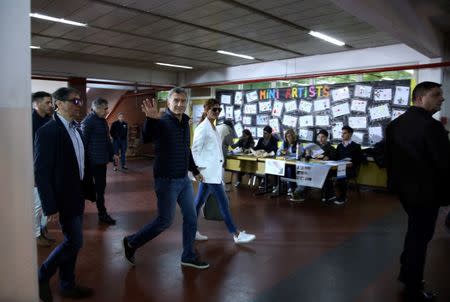 Argentina's President Mauricio Macri and First Lady Juliana Awada leave a polling station after voting in Buenos Aires, Argentina October 22, 2017. REUTERS/Marcos Brindicci