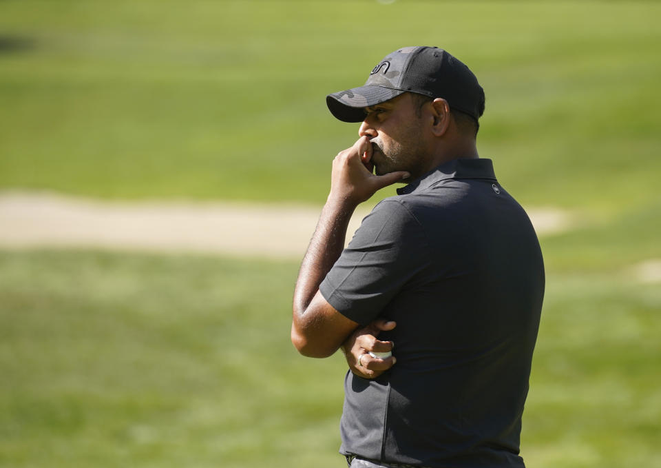 Anirban Lahiri, of India, looks on from the 13th green during the second round of the LIV Golf Invitational-Boston tournament, Saturday, Sept. 3, 2022, in Bolton, Mass. (AP Photo/Mary Schwalm)