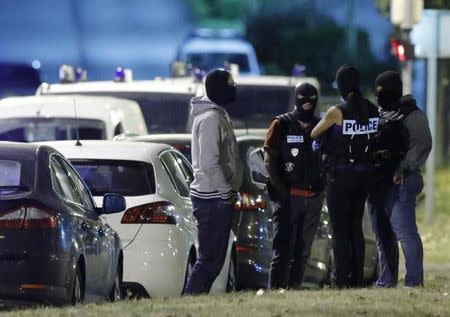 French policemen take part in a police raid in Boussy-Saint-Antoine near Paris, France, September 8, 2016. French police investigating the abandonment of a car packed with gas cylinders near Paris's Notre Dame cathedral last Saturday, arrested three women on Thursday evening, in Boussy-Saint-Antoine, some 30 km south-east of Paris. REUTERS/Christian Hartmann