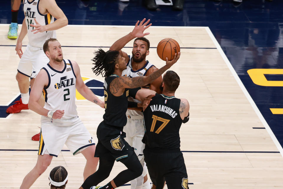 May 23, 2021; Salt Lake City, Utah, USA;  Utah Jazz center Rudy Gobert (27) looks to block the shot of Memphis Grizzlies guard Ja Morant (12) during the second quarter at Vivint Arena. Mandatory Credit: Chris Nicoll-USA TODAY Sports